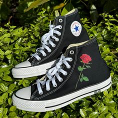 These black high top Converse have a single rose on outsides of both shoes. We source each pair of blank shoes BRAND NEW directly from Converse. The ink is permanent and will never come off. Made in the USA. This price includes everything: shoes and artwork. Sizes listed are in US sizing scale. If you have any issues with your order, please feel free to reach out to us and we will be more than glad to help you! Note: Blvd Custom is in no way affiliated with any of the shoe brands or companies th Custom Shoes Converse High Tops Black, Black Converse Custom Sneakers With Rubber Sole, Painted Converse Black, Black High Top Converse Embroidery, Black High-top Sneakers With Floral Embroidery, White Low Top Converse, Custom Converse Shoes, White High Top Converse, Black High Top Converse