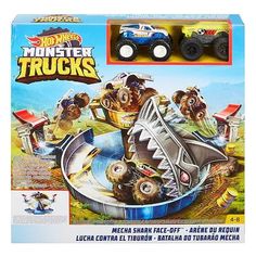 a toy truck with monster trucks on it's back in a cardboard packaging box