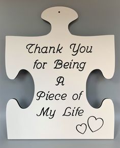 a piece of my life sign hanging on the wall in front of a gray background