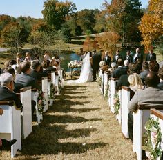 an outdoor wedding ceremony in the fall