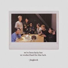 a group of people standing around a table with a cake on it and an advertisement for the songbook, we've been lucky but we worked hard for that luck