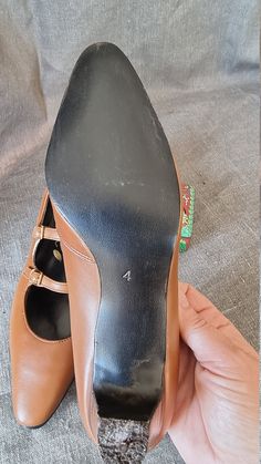 "In leather Heel 4.5 cm Needs to be re-heeled Size 4 inside 24 cm width 7 cm Size 4.5 inside 24.5 cm width 7 cm Size 5 inside 25 cm width 7 cm Size 5.5 inside 25.5 cm width 7.5 cm Size 6 inside 26 cm width 7.5 cm Size 6.5 inside 26.5 cm width 8 cm Size 7 inside 27 cm width 8 cm Our shoes have never been used and are in excellent condition. Most of our pairs will be delivered in the original carton. As they have been in storage for 40+ years, they can have a bit of an \"attic\" smell. If you use Leather Mary Janes With 4-inch Heel And Round Toe, Leather Kitten Heels With Round Toe, Office Kitten Heels With Heel Strap And Round Toe, Mary Jane Heels With Almond Toe And Leather Sole, Mary Jane Leather High Heel Shoes Medium Width, Brown High Heel Mary Janes For Formal Occasions, Office Kitten Heels With Removable Insole And Round Toe, Office Kitten Heels With Round Toe, Formal Brown High Heel Mary Janes