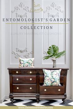 an old dresser with pillows and a potted plant on top