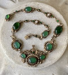 "Stunning Circa 1800s Victorian Austro Hungarian Green Chrysoprase Pearl Silver Gilt Royal Crown Antique Necklace Measures aprox 16 1/2\" Around Weighs 45.8 grams See pictures next to ruler fro scale has been tested and tests silver Although this is Hungarian pice it has a very unique Italian peruzzi feel" Vintage Jeweled Oval Necklace, Vintage Oval Jeweled Necklace, Vintage Oval Jeweled Necklaces, Victorian Jeweled Necklaces For Formal Occasions, Victorian Green Jeweled Jewelry, Victorian Green Jewelry With Jewels, Green Victorian Necklace For Wedding, Victorian Oval Green Necklace, Antique Green Jeweled Necklace