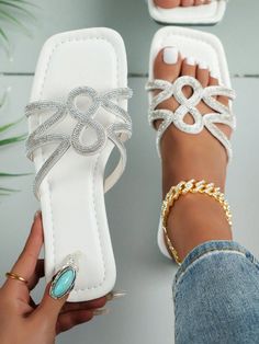 Experience the ultimate blend of style and comfort with our Sparkling Summer: Rhinestone Flat Sandals for Women. These sandals are designed with a sparkling rhinestone for a touch of glamour, while the flat sole provides all-day comfort. Elevate any outfit while feeling confident and chic. Perfect for the summer season. Type : Slides Color : White Style : Glamorous Pattern Type : Plain Toe : Open Toe Details : Rhinestone Upper Material : PU Leather Lining Material : PU Leather Insole Material : PU Leather Outsole Material : Rubber Flat Synthetic Sandals With Bling, White Glitter Open Toe Sandals, Bedazzled Flat Sandals For Summer, Spring Bedazzled Flat Sandals, Synthetic Toe Post Sandals With Rhinestones, Bedazzled Flat Beach Sandals, Sparkling Flat Sandals For Summer, Spring Beach Sandals With Sparkling Details, Sparkling Beach Sandals For Spring