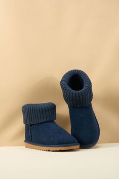 Step into cozy style with the SMAIBULUN Ugg Ankle Knit Stocking Short Boots. The ankle knit design can be folded for extra warmth, perfect for chilly days. The deep navy color adds a touch of sophistication to these versatile boots. Elevate your winter wardrobe with these must-have boots! 1'' heel 6.2'' shaft 15.2'' circumference Pull-on Lightly padded footbed Leather suede upper Faux fur lining Lightweight cushioning EVA sole Feature: Ankle knit stocking can be folded supply extra warm. Casual Round Toe Booties For Winter, Cozy Knitted Booties With Round Toe, Comfortable Winter Booties With Round Toe, Cozy Round Toe Booties For Fall, Casual Winter Booties With Padded Ankle, Cozy Fall Booties With Round Toe, Comfortable Warm Booties For Winter, Comfortable Warm Booties With Round Toe, Warm Comfortable Booties With Round Toe