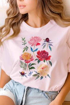 Introducing our Peony Flowers T-Shirt - a beautifully crafted shirt designed with love and care. Each tee showcases delicate watercolor peony paintings, bringing a touch of nature’s gentle beauty to your wardrobe. Available in a variety of colors and sizes, this shirt offers a perfect fit for everyone. Embrace the elegance of blooming peonies and let your style flourish. Our Peony Flowers T-Shirt Tee is made to brighten your day and nurture your love for art and nature. Bring home this floral tr Pink Graphic Tee With Plant Print, Pink Graphic Tee With Plants Print, Pink Crew Neck Top With Plant Print, Spring Rose Print Graphic Tee, Spring Graphic Tee With Rose Print, Spring Cotton T-shirt With Rose Print, Spring Rose Print Short Sleeve T-shirt, Pink Cotton T-shirt With Plant Print, Summer Short Sleeve T-shirt With Rose Print