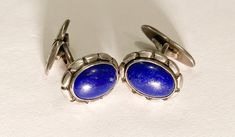 We offer a lovely and rare pair of Art Nouveau style Georg Jensen Sterling Silver and Lapis  cufflinks. These are pattern number 33 and were designed by Georg Jensen before 1910. These were made in the early 1930's. The Lapis  and Silver is in perfect condition, there are no cracks, scratches or any other flaws.  The face of the cufflinks is approx 3/4 inch by 1/2 inch and they weigh approx. 12 grams. These number 33 cufflinks are a little smaller and lend themselves to ladies French cuffs as we Modernist Oval Jewelry For Formal Occasions, Art Deco Clip-on Jewelry For Formal Occasions, Formal Art Deco Clip-on Jewelry, Clip-on Art Deco Jewelry For Formal Occasions, Classic Round Earrings For Business, Modernist Engraved Jewelry For Formal Occasions, Vintage Polished Finish Cufflinks, Antique Cufflinks With Polished Finish, Antique Business Cufflinks With Polished Finish