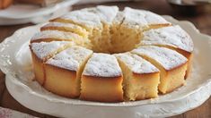 a cake on a plate with powdered sugar