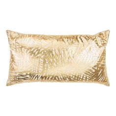 a gold and white pillow on a white background