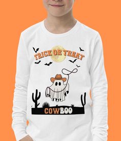 Looking for a cute Halloween Cowboy Ghost long sleeve tee for your kid? How about a funny Halloween Gift for your grandkids? This Western kids Shirt is perfect. It can also be used as a Halloween Costume.   DESCRPITION  - The shirt is made of airlume combed and ring-spun cotton and will feel soft and comfy to the always energetic youth - Regular fit SIZING:  Please see the sizing guide in pictures in order to find the best size for you. This is a unisex item. SHIPPING -This item is shipped out w Spooky Long Sleeve T-shirt With Cartoon Print, Funny Long Sleeve T-shirt With Character Print, Fun Long Sleeve Halloween T-shirt, White Long Sleeve Halloween T-shirt, White Long Sleeve T-shirt For Halloween, Funny Long Sleeve Halloween T-shirt, Western Kids, Halloween Cowboy, Cowboy Ghost