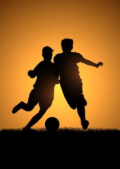 two people are playing soccer against an orange sky