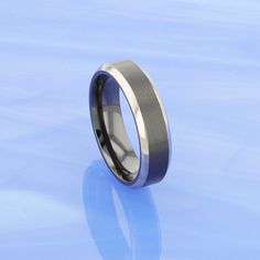 a wedding ring is shown on a blue background