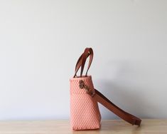 Why fall in love with our Woven Purse Collection? * Each bag is a unique masterpiece, with only one piece per design.* Peach Mexican Artisan Bag.* Crafted with care, featuring both short leather handles and long leather straps for an authentic touch.* Discover endless versatility with our bags, perfect for any occasion.* Meticulously handcrafted by skilled artisans.* Environmentally: made from top-quality recycled plastic. Daily Use Bucket Satchel With Braided Handles, Rectangular Bucket Bag With Leather Handles For Everyday Use, Daily Use Crossbody Satchel With Leather Handles, Handmade Top Handle Shoulder Bag For On-the-go, Leather Handles Crossbody Satchel For Daily Use, Handmade Crossbody Satchel For On-the-go, Chic Handmade Bucket Bag For Everyday Use, Handmade Top Handle Bucket Bag For Everyday Use, Daily Use Bucket Bag With Double Leather Handles