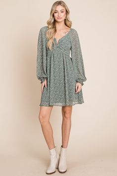 The perfect breezy dress to wear year-round, featuring a flattering draped fit, long sheer sleeves, split-neck detail, and open back. Material: 100% Polyester, 100% Rayon lining Flowy V-neck Dress With Surplice Neckline For Date Night, Flowy Long Sleeve V-neck Dress For Party, Feminine Long Sleeve Chiffon Dress For Spring, Fitted Long Sleeve Chiffon V-neck Dress, Chic Green Flowy V-neck Dress, Casual Long Sleeve Chiffon Dress For Fall, Chic Chiffon V-neck Midi Dress, Flowy Long Sleeve Chiffon Dress Casual, Casual Flowy Chiffon Long Sleeve Dress