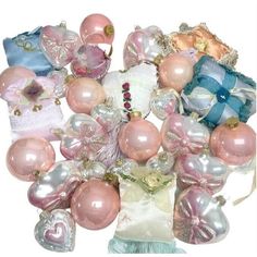 a bunch of pink and white ornaments on display