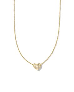 Meet the Holland Gold Heart Short Pendant Necklace in White Crystal, the epitome of understated elegance. As radiant as it is romantic, this sleek metal heart is adorned with flush-set crystals in round and marquise shapes and embellished with bright-cut decorative engravings. Styled, stacked, or gifted, this pendant i Winter Flags, Spring Garden Decor, Short Pendant Necklace, Heart Pendant Gold, Metal Heart, Bookish Gifts, White Crystal, Understated Elegance, Brass Material