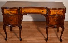 an antique desk with two drawers on it