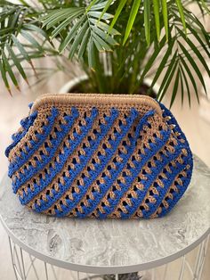 Blue-Beige Color Paper Raffia Yarn Knitted Clutch Blue Color Lining / Flat pocket Magnetic Frame Closure Length: 24 cm (9.4 inches) Width: 34 cm (13.3 inches)  Bag Base: 30 cm (11.8 inches) Bag Frame: 25 cm (9.8 inches) Blue Crochet Shoulder Bag With Braided Handles, Vacation Blue Crochet Bag, Blue Crochet Travel Pouch Bag, Blue Hand Knitted Rectangular Bag, Blue Crochet Bag With Braided Handles, Blue Rectangular Crochet Bag With Braided Handles, Blue Woven Straw Shoulder Bag, Blue Knitted Shoulder Bag For Daily Use, Blue Knitted Shoulder Bag For Everyday