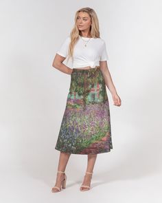 "Timeless and chic, our Women's A-line Midi Skirt is made from a beautifully draped smooth chiffon. Polished with a thick waistband and side zipper, it's fitted at your waist and has a flowy bottom. A-line cut Side zipper Thick waistband Printed, cut, and handmade Fitted hips Hits below calf Size up for a relaxed fit Model is 5'9\" wearing a size Medium Model hips are 38\" Skirt Length 33\" Machine wash cold, tumble dry low 100% Polyester, Heavy Chiffon This product is made custom and specially for you as soon as you place an order, which is why it takes us a bit longer to deliver it to you as well as why we can not accept returns. Making products on demand instead of in bulk helps reduce overproduction, so thank you for making thoughtful purchasing decisions!" Fitted Green Skirt For Garden Party, Fitted Flared Skirt For Garden Party, Fitted Long Skirt For Garden Party, Spring A-line Skirt For Garden Party, Monet's Garden, Cute Clothing, Clothing Art, A Line Cut, Artist Gifts