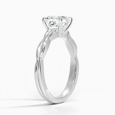 a white gold engagement ring with a twisted band