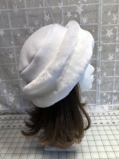 "I made this beautiful Snow White hat out of soft white beaver faux fur and white fleece. The brim is a 3 1/2 inch frame of white beaver faux fur and the hat is lined with a double layer of white fleece for warmth and comfort. Sized to fit most adults 22\"-23\" around head. The hat is a comfortable fit on my 22 1/2\" head. Spot clean or dry clean. Handmade in Albany, Oregon by me!" White Faux Fur Winter Hat, White Hat With Faux Fur Lining For Winter, White Winter Hat With Faux Fur Lining, White Fur Felt Hat For Winter, White Fur Felt Winter Hat, White Brimmed Felt Hat For Winter, Adjustable White Felt Hat For Winter, White Short Brim Felt Hat For Winter, Adjustable White Fur Felt Hat