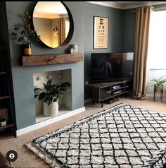 a living room with blue walls and a black and white rug