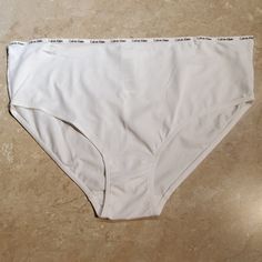 White Cotton Panty By Calvin Klein. Logo Waistband. 95% Cotton/ 5% Elastane Nwot Everyday Cotton Bottoms By Calvin Klein, Calvin Klein Cotton Bottoms With Logo Waistband, Calvin Klein Cotton Bottoms For Everyday, Calvin Klein Wide Leg Cotton Bottoms, Calvin Klein Casual Bottoms With Logo Waistband, Calvin Klein Thong, Calvin Klein Ck One, Calvin Klein White, Calvin Klein Women