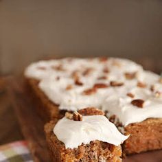 two slices of carrot cake with white frosting