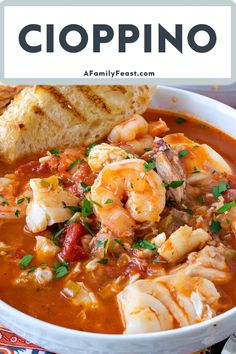 a white bowl filled with shrimp and tortilla soup next to a piece of bread