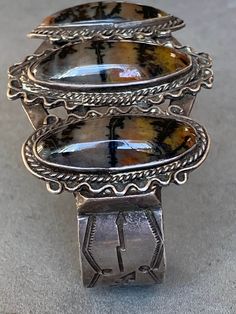 "Petrified Wood Sterling Cuff Hand made Navajo Cuff 6 3/4\" x 1 3/4\" inside 5 5/8\" opening 1 1/4\"" Southwestern Style Cuff Bracelet, Metal Jewelry Making, Turquoise Squash Blossom, Southwest Art, Jewelry Antique, Southwestern Jewelry, Petrified Wood, Gold Stars, Turquoise Jewelry