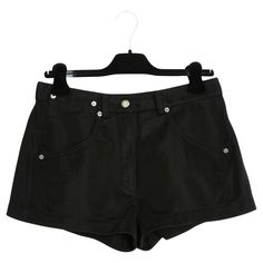 Louis Vuitton mini shorts by Nicolas Ghesquière (circa 2016) in black jersey (both soft and rigid), 2 large jean pockets on the front, one with an additional mini pocket and 2 large jean pockets on the back, the studs, button and zip are in silver metal and LV logo, brand label not photographed but present. No more label of composition or size but the measurements indicate a 38/40FR: waist (high) 40 cm, crotch 29 cm, inseam 3 cm, total length 28 cm, thigh width 30 cm. The shorts are in excellent Logo Lv, Lv Logo, Jean Pockets, Nicolas Ghesquiere, Mini Short, Mini Shorts, Short Outfits, Metallic Silver, Metallica