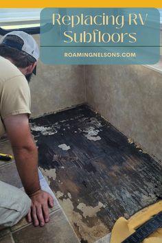 a man laying tile on top of a bathroom floor next to a yellow and black brush