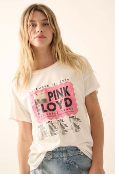 Garment washed graphic t-shirt. Vintage-style Pink Floyd "The Later Years" graphic print with album art and track listing. Round neckline. Short sleeves. Drop shoulder. Curved hem. Relaxed fit. 100% Cotton. Imported top designed and printed in LA. Officially licensed Pink Floyd merchandise. Model wears size S. Acid Wash Band Merch T-shirt With Graphic Print, White Grunge Tops For Music Festivals, Graphic Print Tops For Music Festivals And Concerts, Grunge Tops With Screen Print For Music Festivals, Relaxed Fit Top With Graphic Design For Music Festivals, Relaxed Fit Graphic Top For Music Festivals, Music Festival Graphic Crew Neck Tops, Graphic Design Crew Neck Top For Music Festivals, Graphic Print Tops For Music Festivals