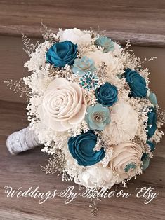 a bridal bouquet with blue and white flowers