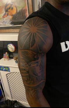 a man with a tattoo on his arm