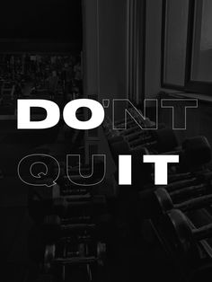 gym equipment with the words don't quit out in white letters on black background