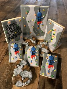 some decorated cookies sitting on top of a wooden table