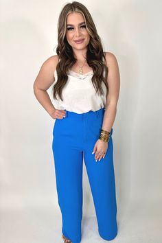 Let's get down to business in these pants! They are the perfect power pant. They feature a high waistline, side pockets, front zip button closure, and elastic banded waistline. Self: 95% POLYESTER/5% SPANDEX , LINING: 100% POLYESTER Small fits 2-6 Medium fits 8-10 Large fits 12-14 Machine wash cold, lay flat to dry Sydney is in a LARGE