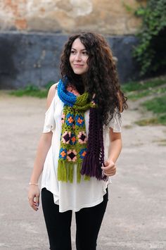 a woman with long hair wearing a scarf