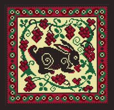 a cross stitch pattern with an animal in the center and red flowers on the border