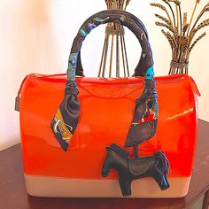 100% Authentic Furla Candy Jelly Hand Bag, Large Bag Approximately (L X W X H): 12 X 7 X 8 Inches Brand New Without Tags, No Dust Bag. Twilly And Charm Included! Elegant Multicolor Large Capacity Satchel, Chic Orange Bag With Large Capacity, Chic Large Capacity Orange Bag, Chic Orange Large Capacity Bag, Elegant Multicolor Bags For On-the-go, Elegant Multicolor Versatile Bag, Orange Top Handle Shoulder Bag With Dust Bag, Orange Top Handle Bag With Handle Drop, Luxury Orange Bags With Large Capacity