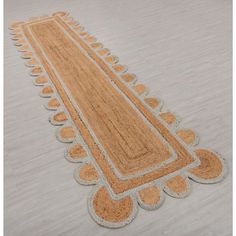 the rug is on the floor and it looks like an intricate design, but not very large