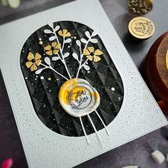 a close up of a card on a table with buttons and other items around it