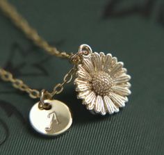 A beautifully intricate and dainty gold plated sunflower pendant hung from a gold plated fine chain. The flower measures 1.2cm (0.5") tall.  You can choose to add the personalisation of a gold plated hand stamped initial tag made with beautiful Calligraphic capital letters from the English language. If you decide that 'no initial required', a tag will not be added to the necklace.  Choose a necklace length tailored to you (please refer to the necklace length guide)  Your necklace will arrive to Elegant Adjustable Sunflower Design Jewelry, Elegant Adjustable Sunflower Jewelry, Elegant Round Sunflower Design Jewelry, Elegant Round Jewelry With Sunflower Design, Elegant Round Sunflower Jewelry, Sunflower Design Jewelry For Anniversary, Sunflower Design Flower Jewelry For Anniversary, Anniversary Gold Jewelry With Sunflower Design, Wedding Jewelry With Sunflower Design