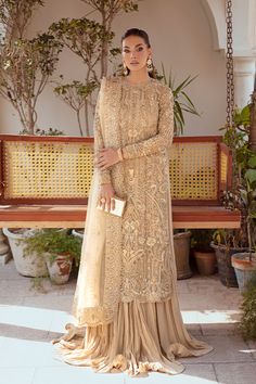 Golden Pakistani Wedding Dress in Trouser Kameez Style Golden Indian Outfits, Eid Sherwani Hand Embellished For Reception, Hand Embellished Sherwani For Eid Reception, Elegant Georgette Sherwani For Wedding, Elegant Wedding Sherwani In Georgette, Hand Embellished Anarkali Unstitched Suit For Wedding, Bollywood Style Hand Embellished Unstitched Wedding Suit, Bollywood Hand Embellished Unstitched Suit For Wedding, Embellished Sharara For Wedding And Eid