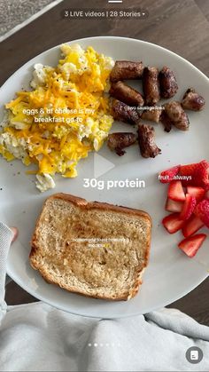 a white plate topped with eggs, toast and fruit