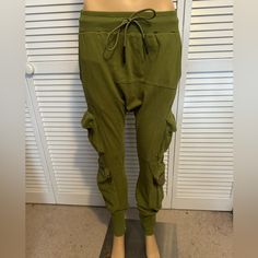 This Is A Cool Pair Of Celestial Walk Pants. They Are Harem Joggers In Olive Green. They Feature Drawstring Waist, Pockets, Cargo Zip Pockets They Are 100% Cotton These Great Pants Are A Size Small/Meduim. Lying Flat They Measure 14” Across The Waist And Have 30” Inseam These Are Beyond Boho Cool And Come New With The Tags Green Cargo Pocket Pants For Loungewear, Green Harem Pants With Pockets For Loungewear, Green Cargo Pants For Loungewear, Harem Pants With Pockets For Loungewear, Green Cargo Bottoms For Loungewear, Fitted Wide Leg Cargo Pants For Loungewear, Bohemian Parachute Pants With Pockets, Fitted Harem Pants With Pockets For Loungewear, Harem Joggers