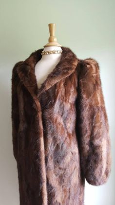 Old Hollywood glamour ✨📸 This vintage 1940s-style glossy mink coat features dramatic puffed sleeves, with padding at shoulders for structure and lift and elasticized wrists; a face-framing portrait collar; a deco-inspired geometric pattern to the fur; two pockets; and a sleek, longer length. Hidden front hook closures, fully lined. Monogrammed CHC. Era: 1960s Label: Strouss Pictured on a US size 6/8 dress form. ➸ visit on instagram | provenance_vintage Brown Winter Wedding Outerwear, Winter Wedding Brown Outerwear, Brown Winter Fur Coat For Formal Occasions, Brown Fur Coat For Formal Winter Occasions, Formal Brown Fur Coat For Fall, Classic Brown Fur Coat For Formal Occasions, Formal Dress Party, Bear Coat, Leopard Coat