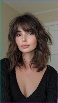 Short hairstyles with bangs are a great way to add personality and style to your look. This photo features 31 chic short hairstyles with bangs that are perfect for any occasion. From blunt bangs to wispy bangs, there's a style for everyone.   #shorthairstyles #bangs #hairstyles #hair #beauty 70s Style Haircut Medium, Squoval Face Hairstyles, Mid Length Hair With Bangs Oval Face, Medium Haircuts For Oval Faces, Thinning Hair Color Ideas, Collarbone Length Hair For Round Faces, Hair Cuts Ideas For Oval Shape Face, Best Hair Styles For Oval Face, Shoulder Length Hair With Bangs Round Face